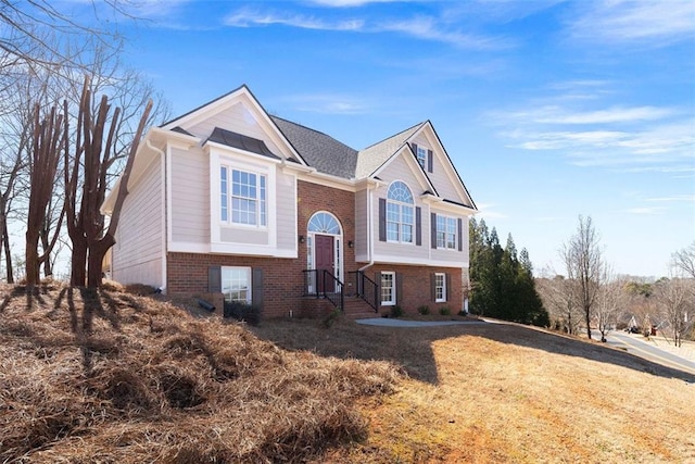 bi-level home with brick siding