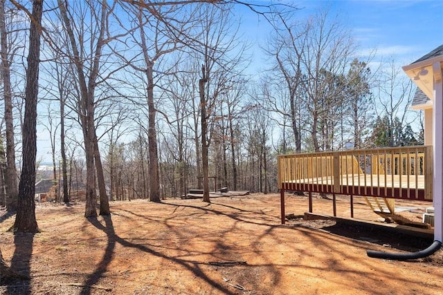 view of yard featuring a wooden deck