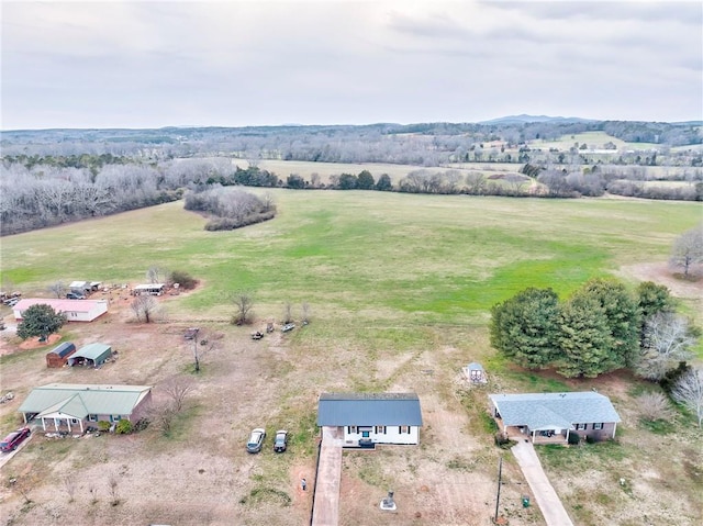 birds eye view of property with a rural view