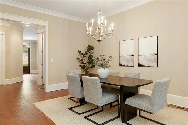 385 Windy Pines Trl, Roswell, GA 30075 - dining space with a chandelier, baseboards, hardwood / wood-style floors, and crown molding