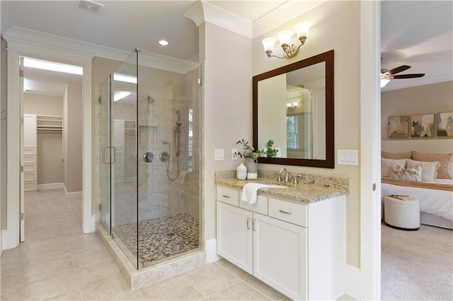 385 Windy Pines Trl, Roswell, GA 30075 - ensuite bathroom featuring a stall shower, vanity, a ceiling fan, ornamental molding, and a spacious closet