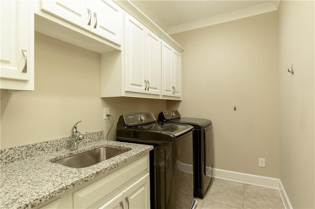 385 Windy Pines Trl, Roswell, GA 30075 - laundry room with washing machine and dryer, cabinet space, baseboards, light tile patterned floors, and ornamental molding