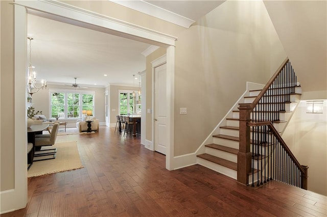 385 Windy Pines Trl, Roswell, GA 30075 - staircase featuring wood finished floors, a ceiling fan, crown molding, baseboards, and a chandelier