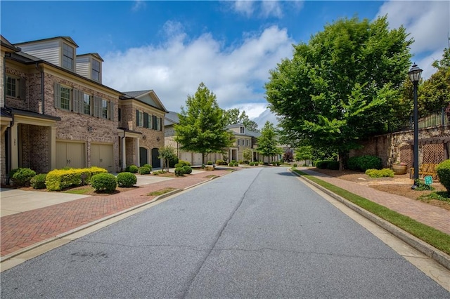 385 Windy Pines Trl, Roswell, GA 30075 - view of asphalt road featuring a residential view, street lighting, curbs, and sidewalks
