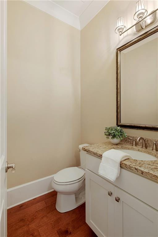 385 Windy Pines Trl, Roswell, GA 30075 - half bath with wood finished floors, vanity, and toilet