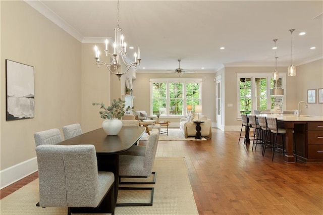 385 Windy Pines Trl, Roswell, GA 30075 - dining area featuring crown molding, recessed lighting, wood finished floors, healthy amount of natural light, and baseboards