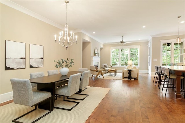 385 Windy Pines Trl, Roswell, GA 30075 - dining area with wood-type flooring, ornamental molding, a chandelier, baseboards, and recessed lighting