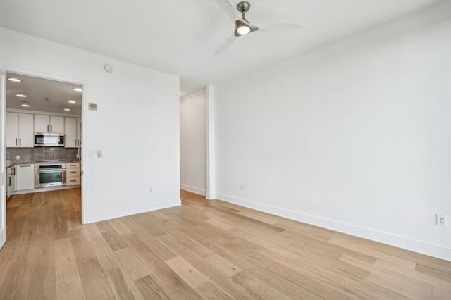 unfurnished living room featuring light wood-type flooring and ceiling fan