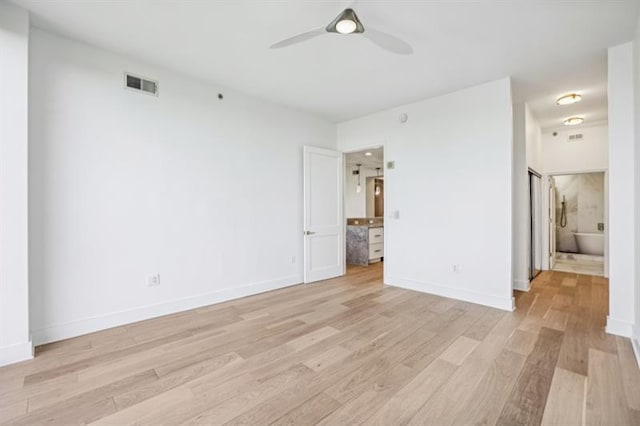 unfurnished room featuring ceiling fan and light hardwood / wood-style floors