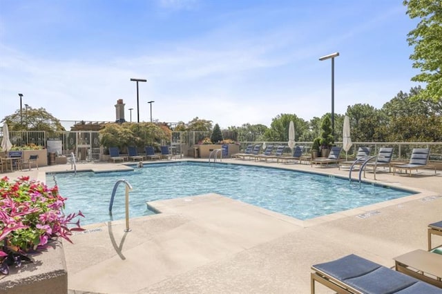 view of swimming pool featuring a patio area