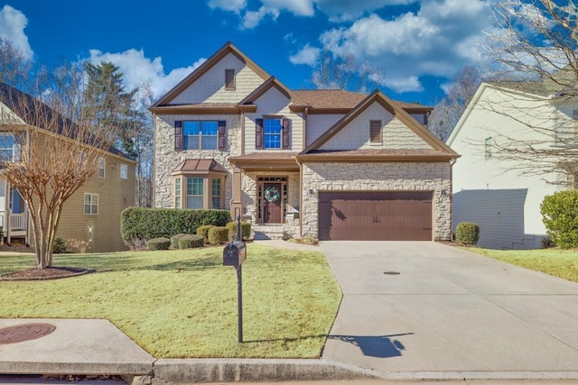 view of front of home with a front yard and a garage