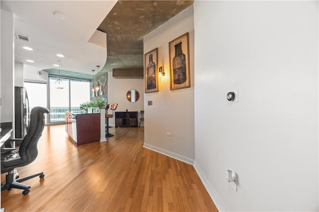 400 W Peachtree St NW Unit 3614, Atlanta, GA 30308 - office area featuring floor to ceiling windows, visible vents, baseboards, and light wood-style floors