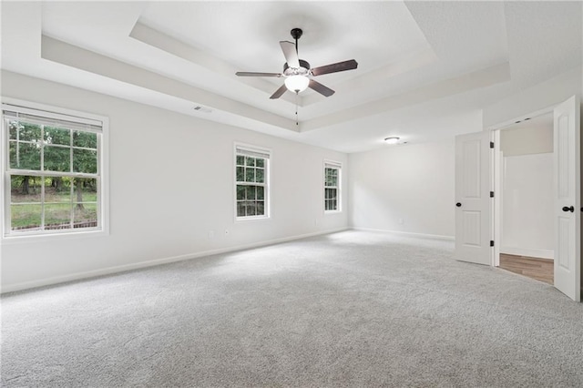 56 Sugar Leaf Ln, Jefferson, GA 30549 - carpeted empty room with a tray ceiling, plenty of natural light, and a ceiling fan