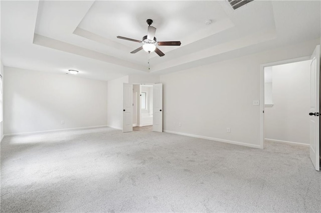 56 Sugar Leaf Ln, Jefferson, GA 30549 - empty room featuring a raised ceiling, a ceiling fan, and light colored carpet