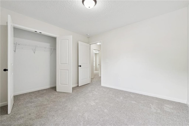 56 Sugar Leaf Ln, Jefferson, GA 30549 - unfurnished bedroom featuring carpet, a textured ceiling, and a closet
