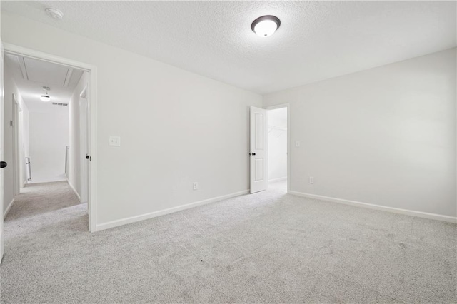 56 Sugar Leaf Ln, Jefferson, GA 30549 - carpeted spare room featuring attic access, a textured ceiling, and a smoke detector