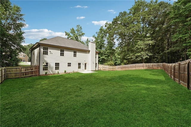 56 Sugar Leaf Ln, Jefferson, GA 30549 - rear view of property with a chimney and a fenced backyard