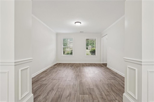 56 Sugar Leaf Ln, Jefferson, GA 30549 - empty room featuring ornamental molding, wood finished floors, and a textured ceiling