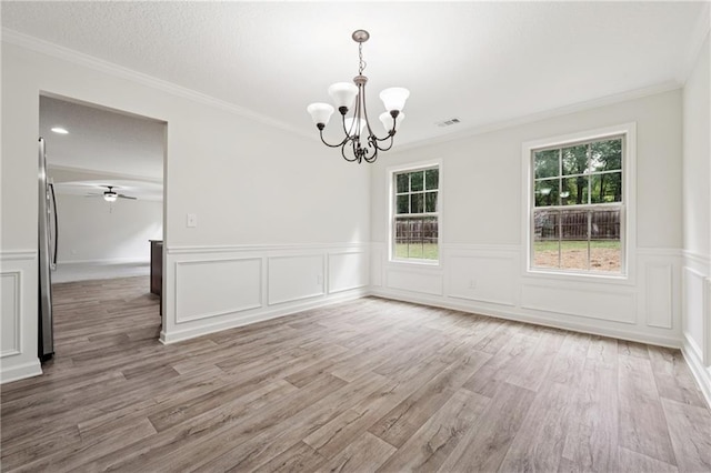 56 Sugar Leaf Ln, Jefferson, GA 30549 - unfurnished dining area featuring a chandelier, light wood-style flooring, a wainscoted wall, ornamental molding, and a decorative wall