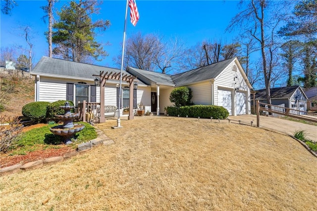 ranch-style home with a garage, driveway, and a pergola