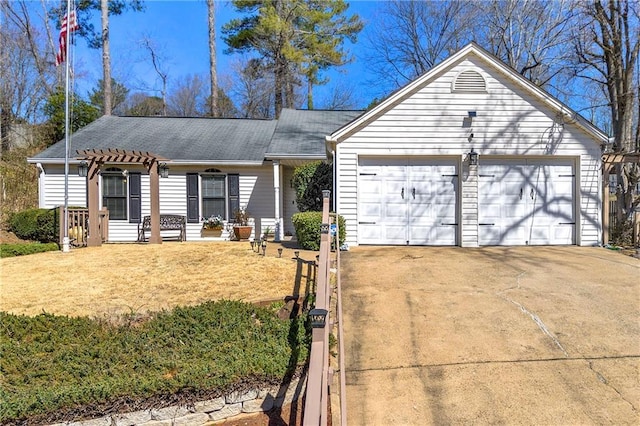 ranch-style house featuring driveway, an attached garage, a front lawn, and a pergola