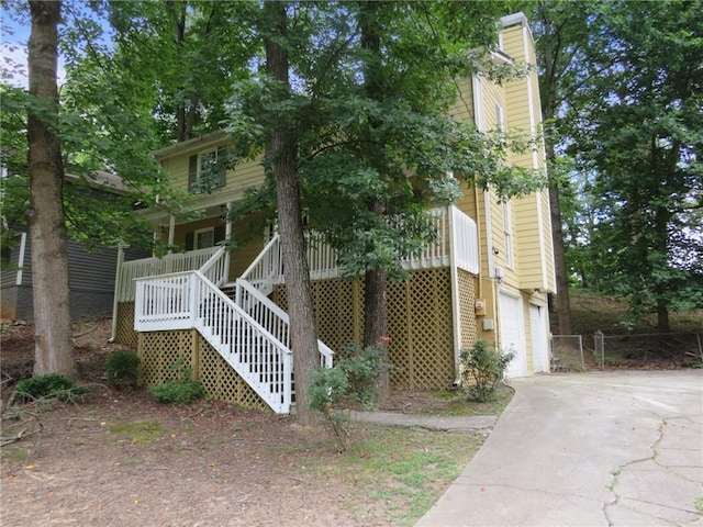 view of front facade with a garage and a porch