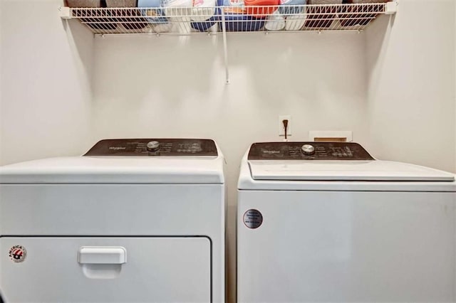 laundry room with separate washer and dryer