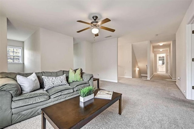 living room with light carpet and ceiling fan