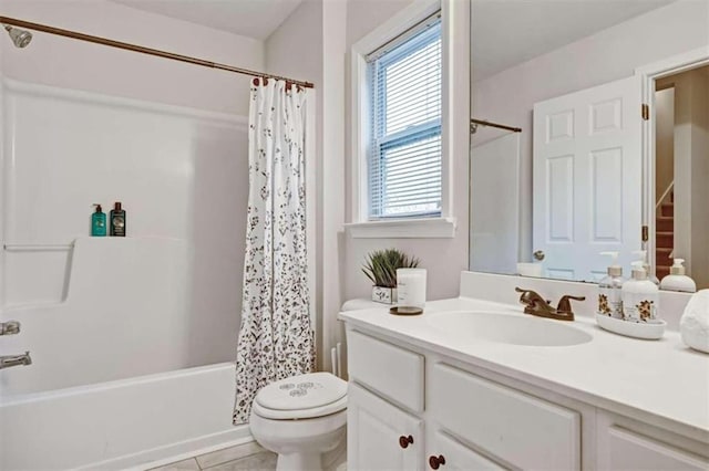 full bathroom with tile patterned flooring, vanity, shower / bath combo, and toilet