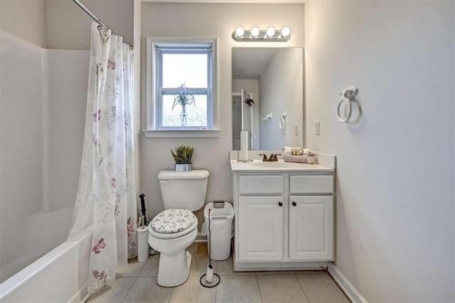 full bathroom featuring tile patterned flooring, shower / bath combination with curtain, vanity, and toilet