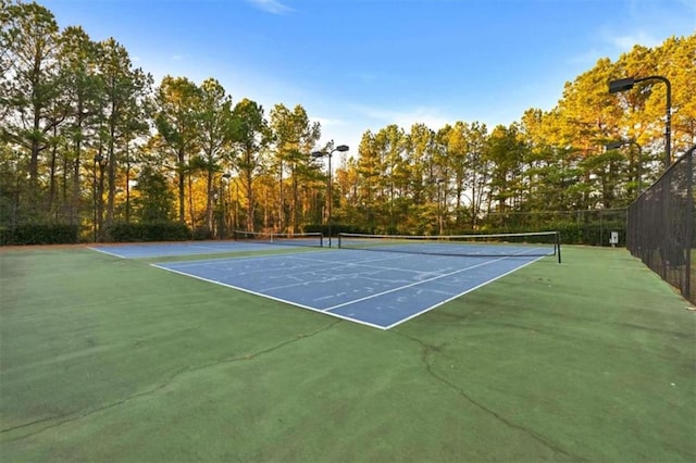 view of tennis court featuring basketball court