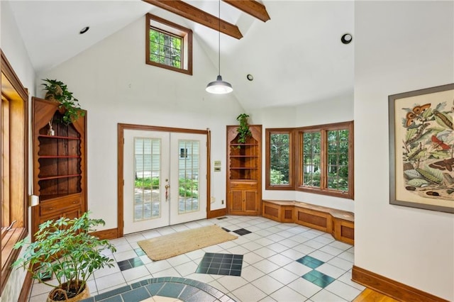 entryway with beamed ceiling and high vaulted ceiling