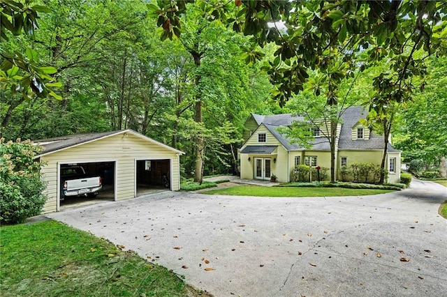 exterior space with a garage and an outdoor structure