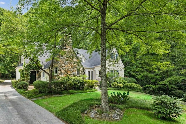 view of home's exterior with a yard