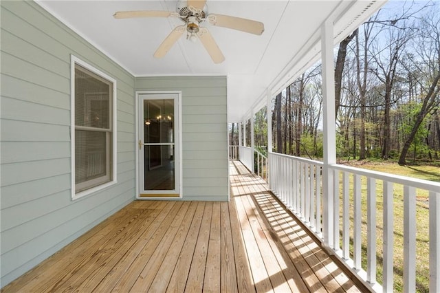wooden terrace with a ceiling fan