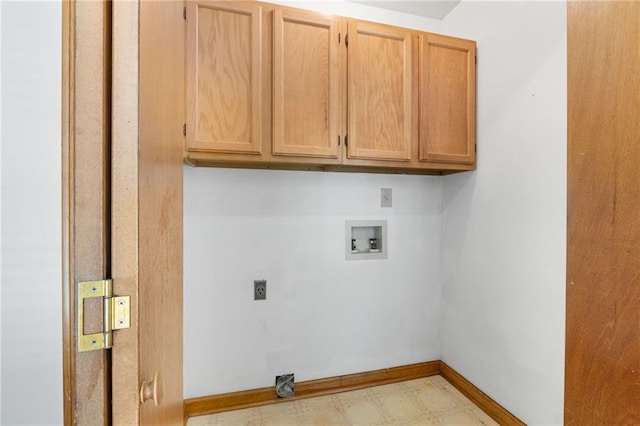 washroom featuring cabinet space, washer hookup, tile patterned floors, electric dryer hookup, and baseboards