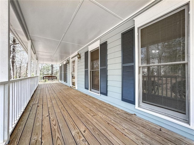 wooden terrace featuring covered porch