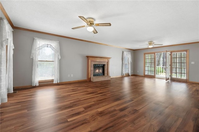 unfurnished living room featuring ceiling fan, ornamental molding, and wood finished floors