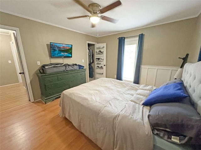 1146 Nelson St, Jackson, GA 30233 - bedroom featuring light wood-style flooring, crown molding, ceiling fan, and a spacious closet