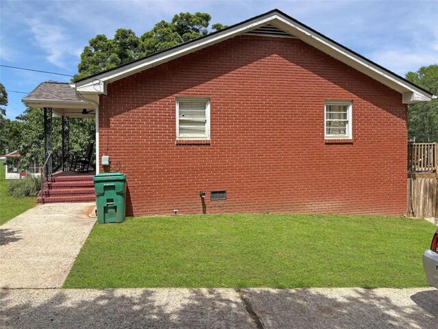 1146 Nelson St, Jackson, GA 30233 - view of side of property featuring a lawn, brick siding, and crawl space