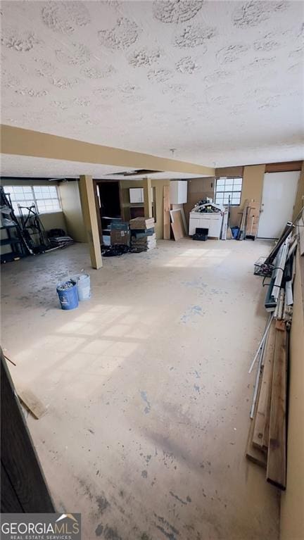 interior space with a healthy amount of sunlight and a textured ceiling