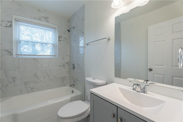 full bathroom featuring vanity, toilet, and tiled shower / bath combo