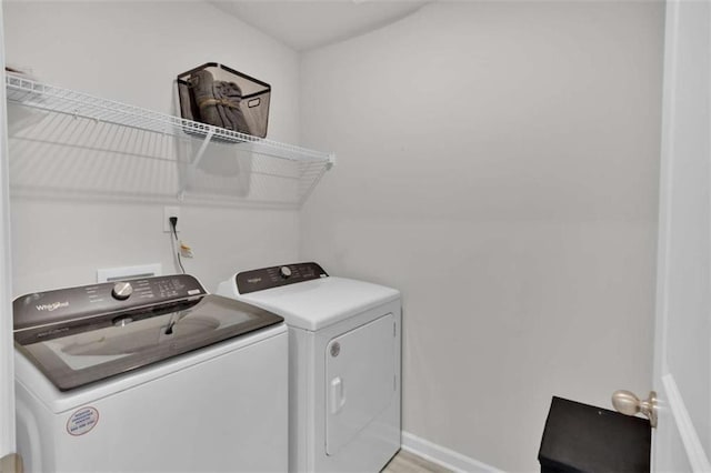 2766 Aralynn Way, College Park, GA 30337 - laundry area featuring separate washer and dryer and baseboards