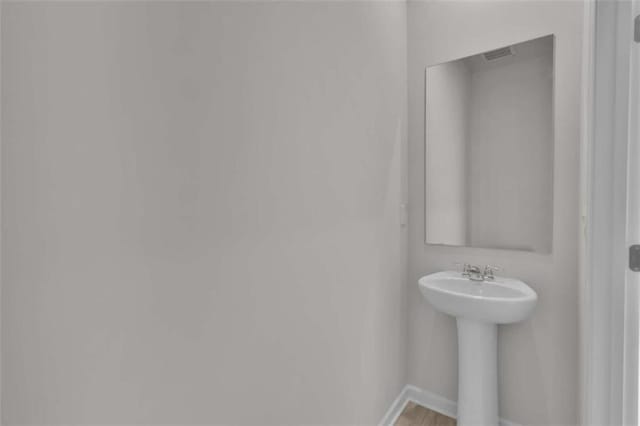 2766 Aralynn Way, College Park, GA 30337 - bathroom with baseboards and a sink