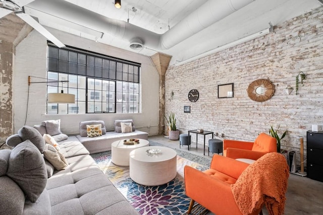 living area featuring concrete floors