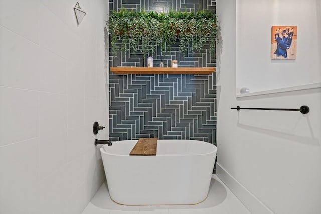 full bathroom featuring a soaking tub and tile walls