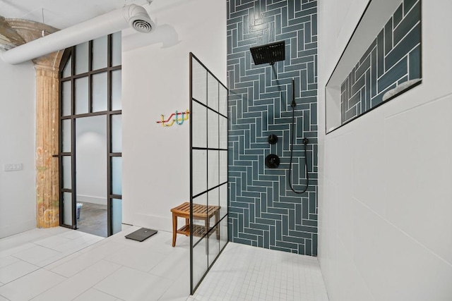 bathroom featuring tile patterned flooring and a walk in shower