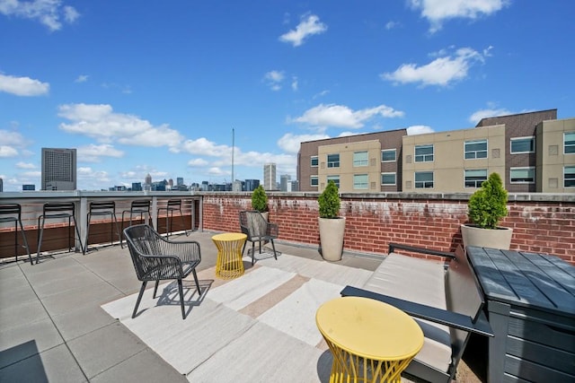 view of patio / terrace featuring a city view