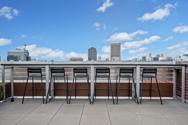 balcony with a view of city and outdoor dry bar