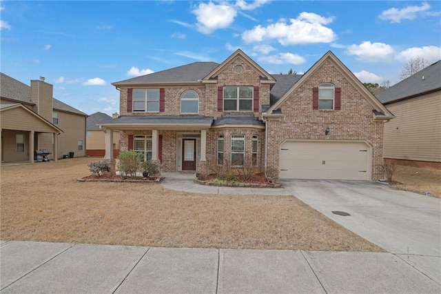 view of front of property with concrete driveway, brick siding, and an attached garage